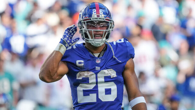MIAMI GARDENS, FLORIDA - DECEMBER 05: Saquon Barkley #26 of the New York Giants looks on during the game against the Miami Dolphins at Hard Rock Stadium on December 05, 2021 in Miami Gardens, Florida.