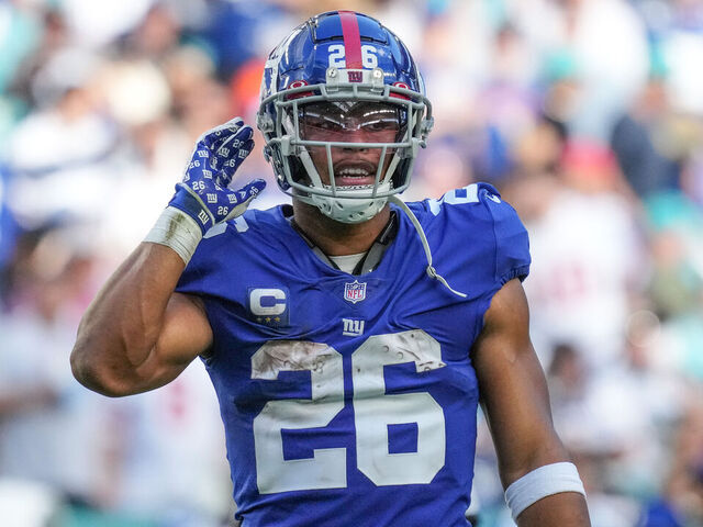 MIAMI GARDENS, FLORIDA - DECEMBER 05: Saquon Barkley #26 of the New York Giants looks on during the game against the Miami Dolphins at Hard Rock Stadium on December 05, 2021 in Miami Gardens, Florida.