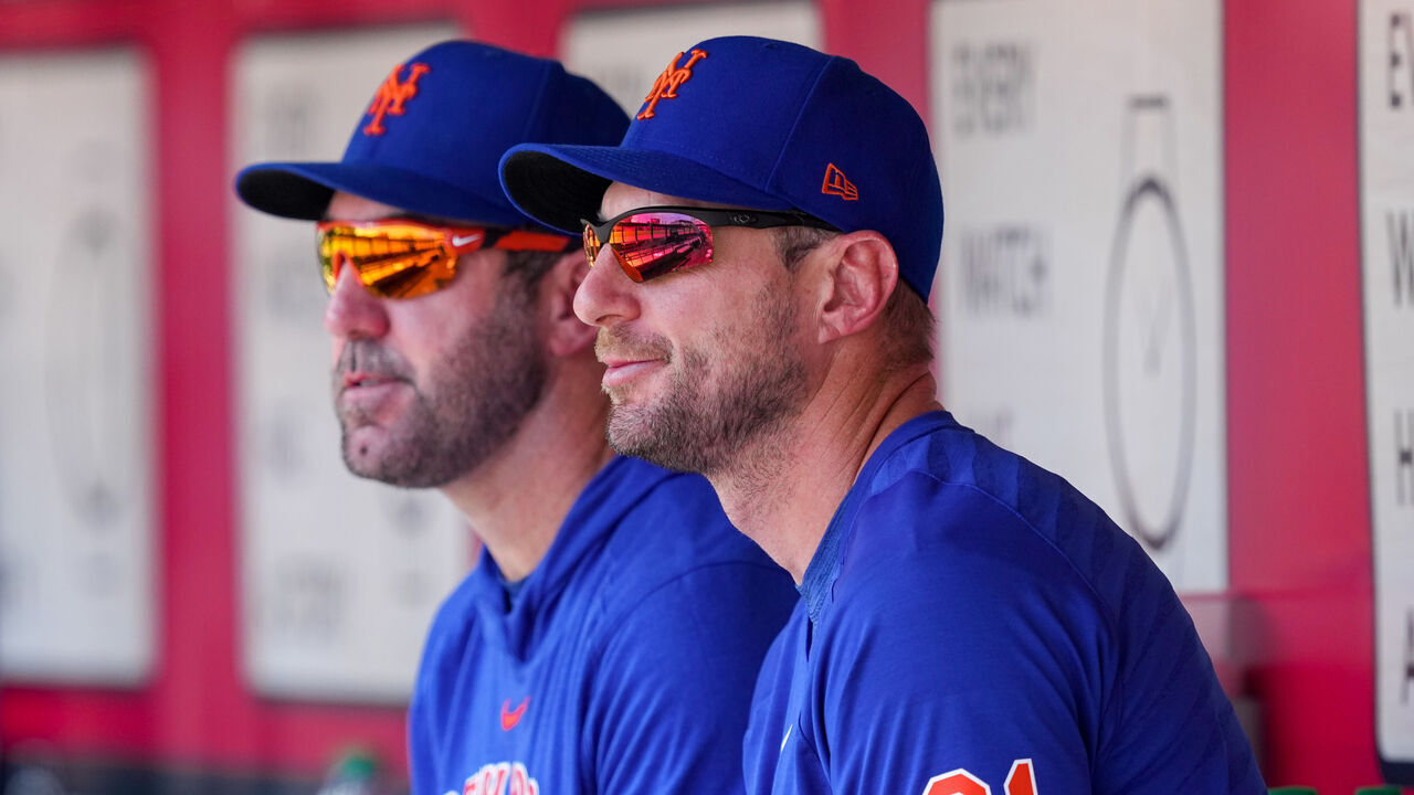 CINCINNATI, OHIO - MAY 11: Justin Verlander #35 (L) and Max Scherzer #21 of the New York Mets look on from the dugout during the game against the Cincinnati Reds at Great American Ball Park on May 11, 2023 in Cincinnati, Ohio.