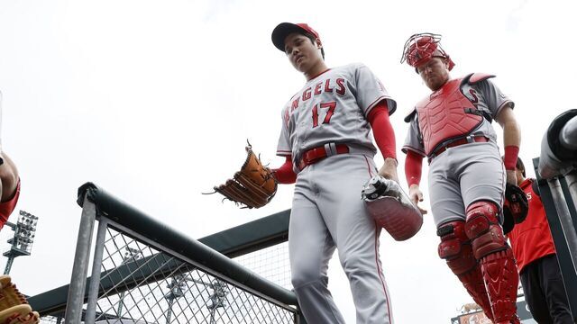 DETROIT, MI - JULY 27: Pitcher Shohei Ohtani #17 of the Los Angeles Angels enters the dugout with catcher Chad Wallach #35 before game one of a doubleheader against the Detroit Tigers at Comerica Park on July 27, 2023 in Detroit, Michigan.