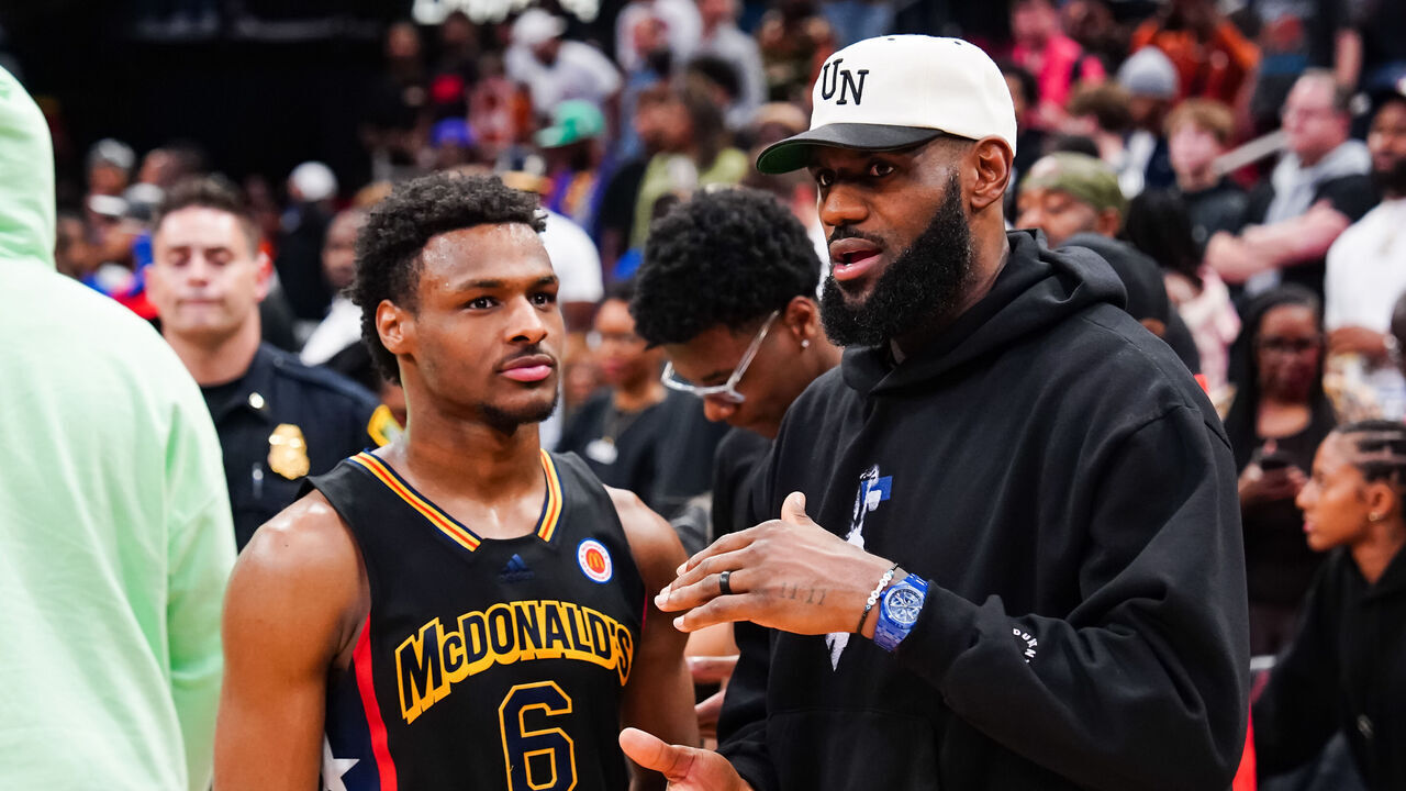 HOUSTON, TEXAS - MARCH 28: Bronny James #6 of the West team talks to Lebron James of the Los Angeles Lakers after the 2023 McDonald's High School Boys All-American Game at Toyota Center on March 28, 2023 in Houston, Texas.