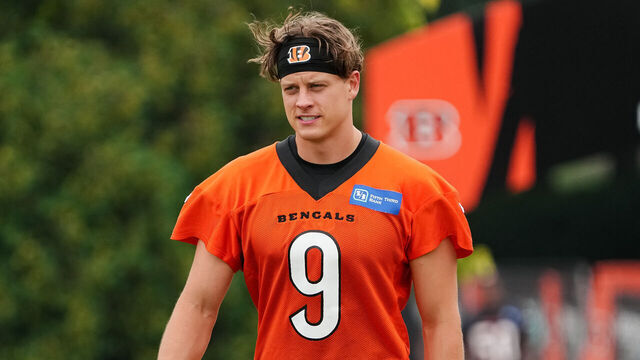 CINCINNATI, OHIO - JULY 26: Joe Burrow #9 of the Cincinnati Bengals walks to the field during training camp at Kettering Health Practice Fields on July 26, 2023 in Cincinnati, Ohio.