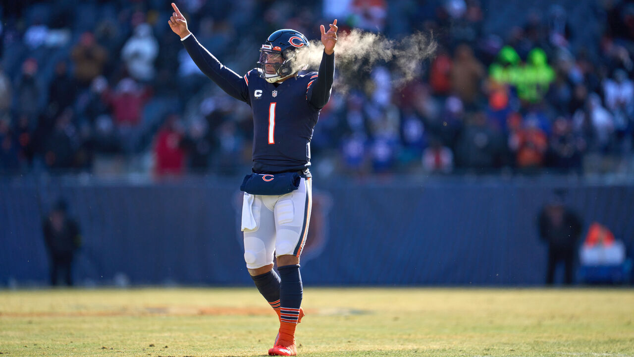 CHICAGO, IL - DECEMBER 24: Chicago Bears quarterback Justin Fields (1) celebrate after a touchdown play in action during a game between the Buffalo Bills and the Chicago Bears on December 24, 2022, at Soldier Field in Chicago, IL.