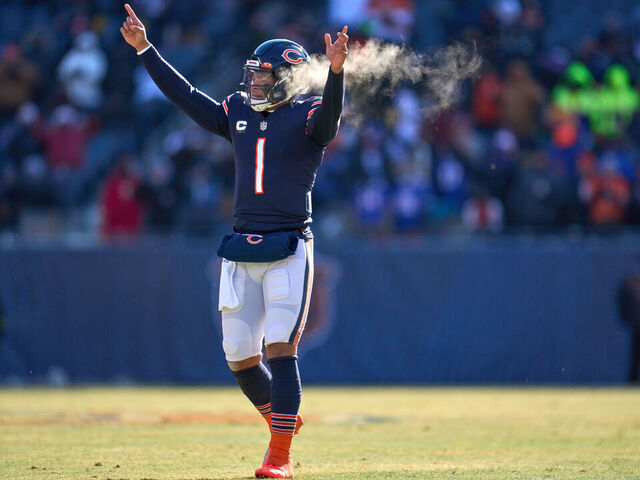 CHICAGO, IL - DECEMBER 24: Chicago Bears quarterback Justin Fields (1) celebrate after a touchdown play in action during a game between the Buffalo Bills and the Chicago Bears on December 24, 2022, at Soldier Field in Chicago, IL.