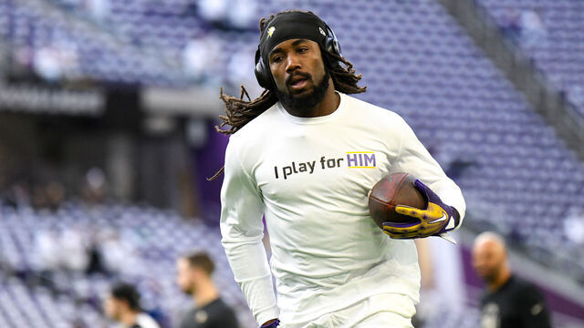 MINNEAPOLIS, MINNESOTA - DECEMBER 24: Dalvin Cook #4 of the Minnesota Vikings warms up against the New York Giants at U.S. Bank Stadium on December 24, 2022 in Minneapolis, Minnesota.