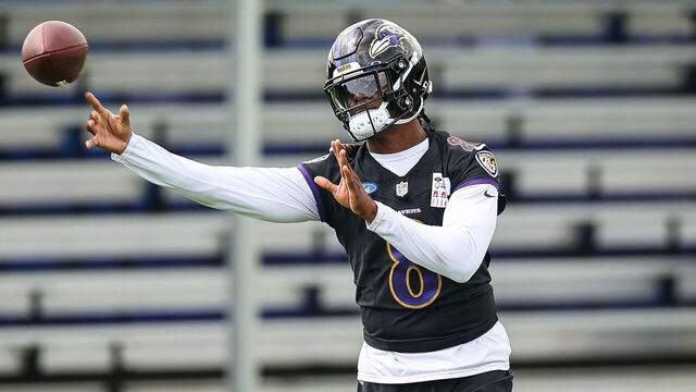 OWINGS MILLS, MD - JULY 27: Lamar Jackson #8 of the Baltimore Ravens attempts a pass during training camp at Under Armour Performance Center Baltimore Ravens on July 27, 2023 in Owings Mills, Maryland.