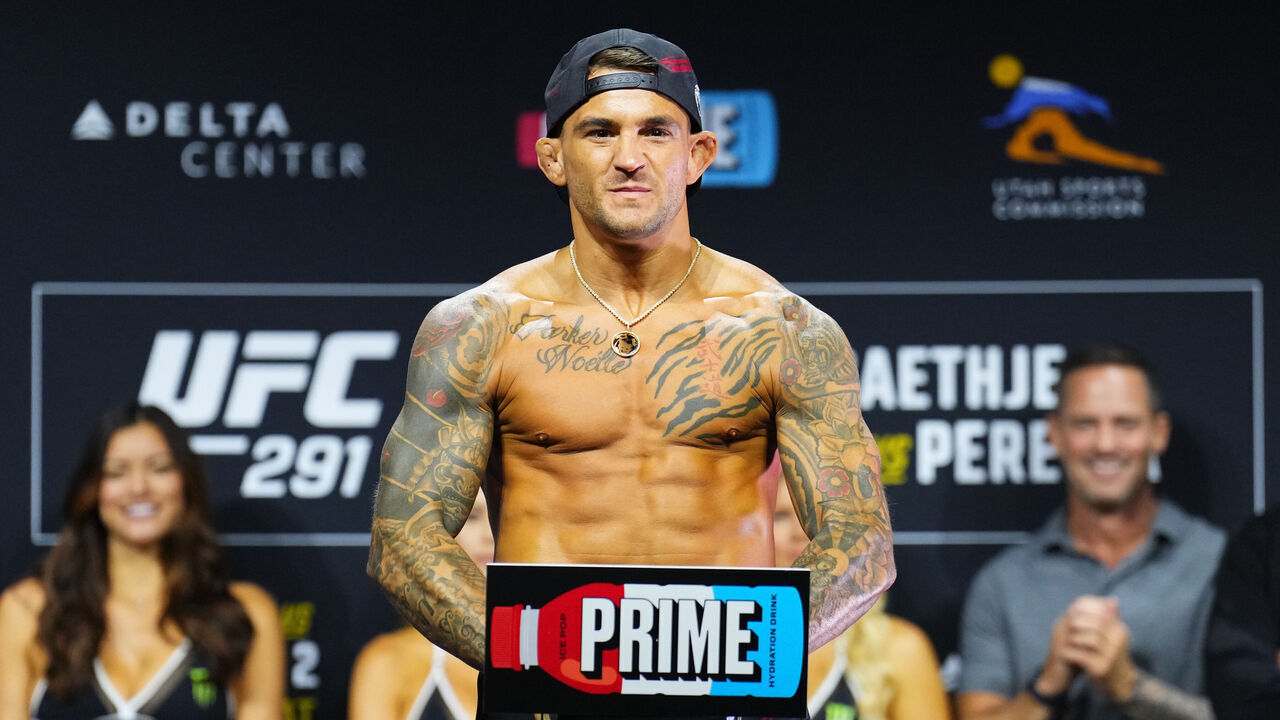 SALT LAKE CITY, UTAH - JULY 28: Dustin Poirier poses on the scale during the UFC 291 ceremonial weigh-in at Delta Center on July 28, 2023 in Salt Lake City, Utah.