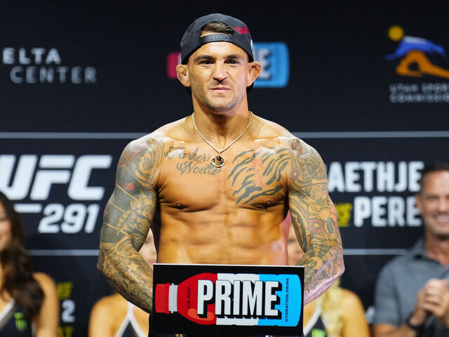 SALT LAKE CITY, UTAH - JULY 28: Dustin Poirier poses on the scale during the UFC 291 ceremonial weigh-in at Delta Center on July 28, 2023 in Salt Lake City, Utah.