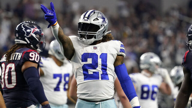 ARLINGTON, TEXAS - DECEMBER 11: Ezekiel Elliott #21 of the Dallas Cowboys reacts to a first down in the first half of a game against the Houston Texans at AT&T Stadium on December 11, 2022 in Arlington, Texas.