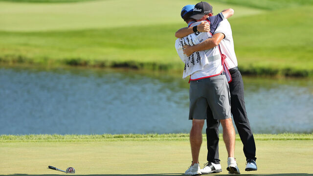 BLAINE, MINNESOTA - JULY 30: Lee Hodges of the United States celebrates winning on the 18th green with caddie Andrew Medley during the final round of the 3M Open at TPC Twin Cities on July 30, 2023 in Blaine, Minnesota.