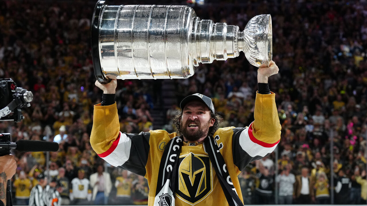 LAS VEGAS, NEVADA - JUNE 13: Mark Stone #61 of the Vegas Golden Knights celebrates with the Stanley Cup after a 9-3 victory against the Florida Panthers in Game Five of the 2023 NHL Stanley Cup Final at T-Mobile Arena on June 13, 2023 in Las Vegas, Nevada.