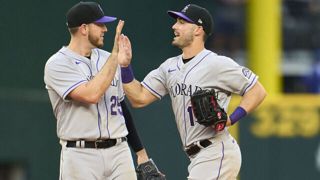 ARLINGTON, TX - APRIL 11: Randal Grichuk #15 and C.J. Cron #25 of the Colorado Rockies celebrates their win over and the Texas Rangers at Globe Life Field on Monday, April 11, 2022 in Arlington, Texas.