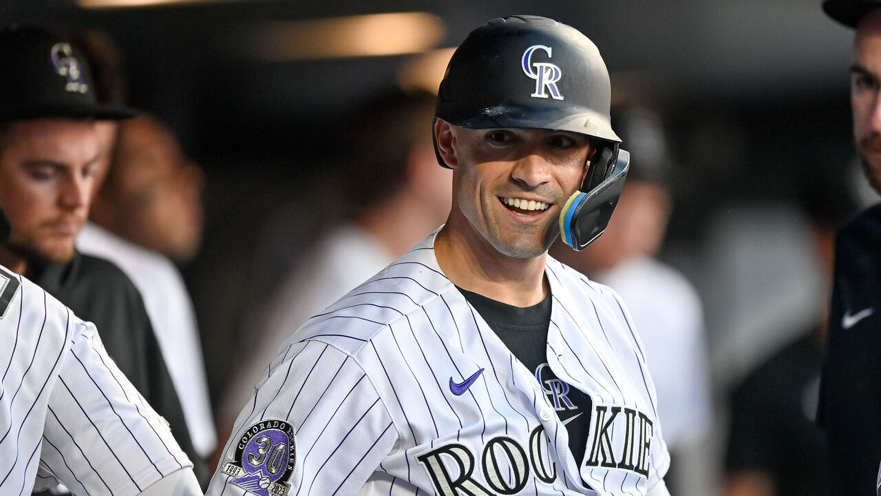 DENVER, CO - JULY 28: Randal Grichuk #15 of the Colorado Rockies celebrates in the dugout after hitting a fourth inning solo home run in a game against the Oakland Athletics at Coors Field on July 28, 2023 in Denver, Colorado.