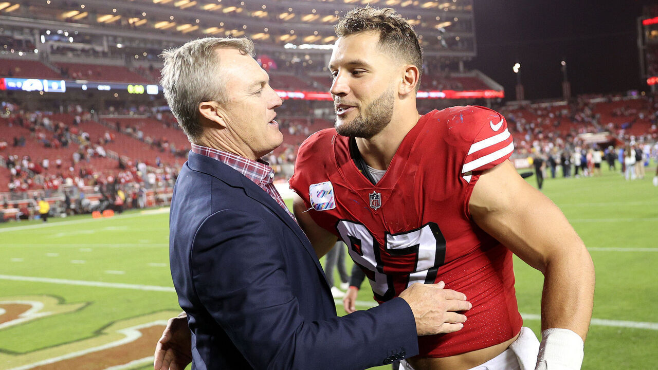 SANTA CLARA, CALIFORNIA - OCTOBER 03: San Francisco 49ers general manager John Lynch congratulates Nick Bosa #97 after they beat the Los Angeles Rams at Levi's Stadium on October 03, 2022 in Santa Clara, California.
