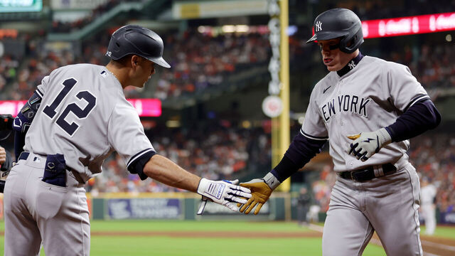 HOUSTON, TEXAS - OCTOBER 19: Harrison Bader #22 of the New York Yankees celebrates with Isiah Kiner-Falefa #12 of the New York Yankees after hitting a solo home run during the second inning against the Houston Astros in game one of the American League Championship Series at Minute Maid Park on October 19, 2022 in Houston, Texas.