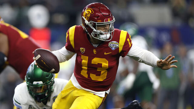 ARLINGTON, TX - JANUARY 2: Caleb Williams #13 of the USC Trojans scrambles against the Tulane Green Wave in the first half of the Goodyear Cotton Bowl Classic on January 2, 2023 at AT&T Stadium in Arlington, Texas.