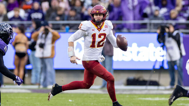 FORT WORTH, TX - NOVEMBER 26: Iowa State Cyclones quarterback Hunter Dekkers (#12) runs up field during the college football game between the Iowa State Cyclones and TCU Horned Frogs on November 26, 2022 at Amon G. Carter Stadium in Fort Worth, TX.