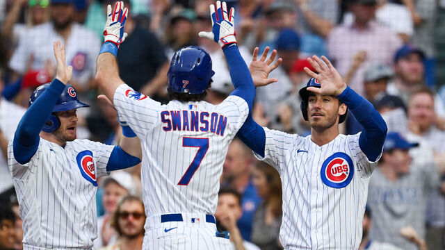 CHICAGO, ILLINOIS - AUGUST 01: Ian Happ #8 and Cody Bellinger #24 celebrates after Dansby Swanson #7 of the Chicago Cubs hit a two-run home run in the first inning against Ben Lively of the Cincinnati Reds at Wrigley Field on August 01, 2023 in Chicago, Illinois.