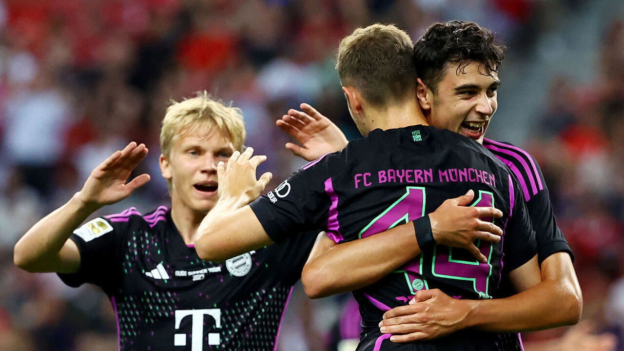 SINGAPORE, SINGAPORE - AUGUST 02: Josip Stanisic #44 () of Bayern Munich celebrates with teammates after scoring their third goal against Liverpool during the second half of the pre-season friendly at the National Stadium on August 02, 2023 in Singapore.
