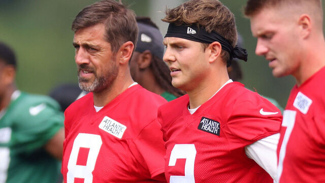 FLORHAM PARK, NEW JERSEY - JULY 20: (L-R) Aaron Rodgers #8, Zach Wilson #2 and Tim Boyle #7 of the New York Jets run drills during training camp at Atlantic Health Jets Training Center on July 20, 2023 in Florham Park, New Jersey.
