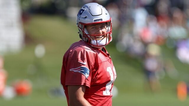 Foxborough, MA - August 1: New England Patriots QB Mac Jones flashes a smile.