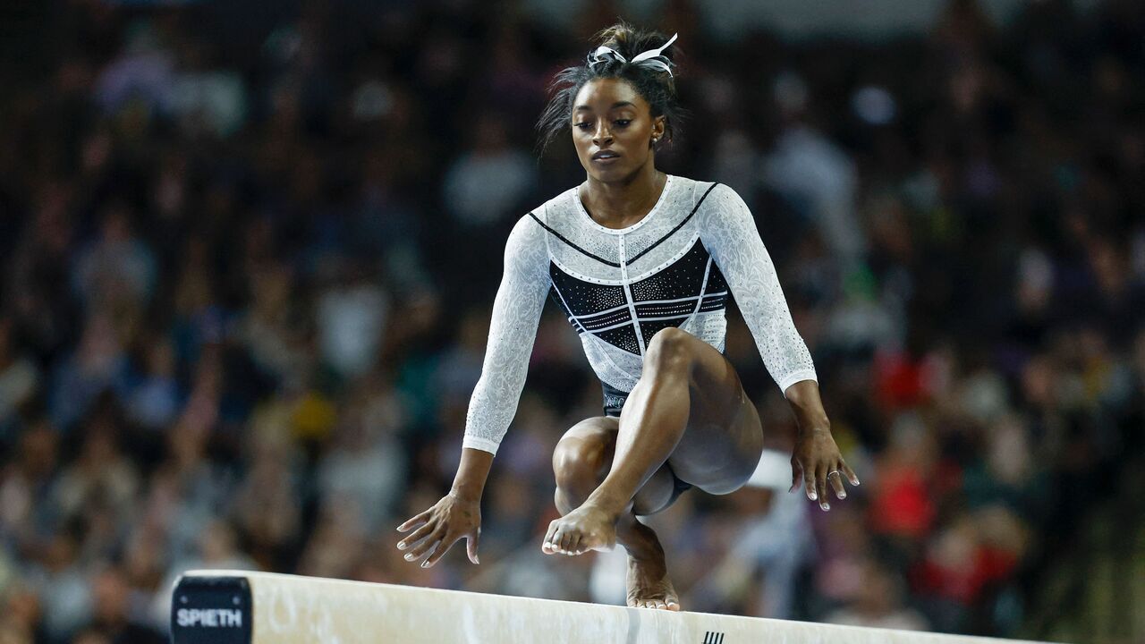USA's Simone Biles, performs on the balance beam, during the 39th edition of the US Classic gymnastics competition at Now Arena in Hoffman Estates, suburb of Chicago, Illinois, on August 5, 2023. Four-time Olympic champion gymnast Simone Biles returned to competition for the first time since the Tokyo Olympics today at the US Classic, ending a two-year hiatus. The 19-time world champion began the event on the uneven bars, where her strong performance received a score of 14.000 points from judges before a cheering sellout crowd in suburban Chicago.