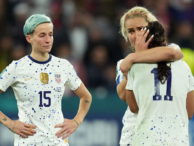 MELBOURNE, AUSTRALIA - AUGUST 06: Lindsey Horan #10 of the United States hugs Sophia Smith #11 as Megan Rapinoe #15 watches after loosing during the penalty kick shootout during the FIFA Women's World Cup Australia & New Zealand 2023 Round of 16 match between Sweden and the United States at Melbourne Rectangular Stadium on August 06, 2023 in Melbourne, Australia.