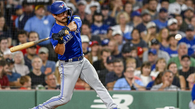 BOSTON, MASSACHUSETTS - AUGUST 04: Davis Schneider #36 of the Toronto Blue Jays hits a ground ball single in the seventh inning of his MLB debut against the Boston Red Sox at Fenway Park on August 04, 2023 in Boston, Massachusetts.