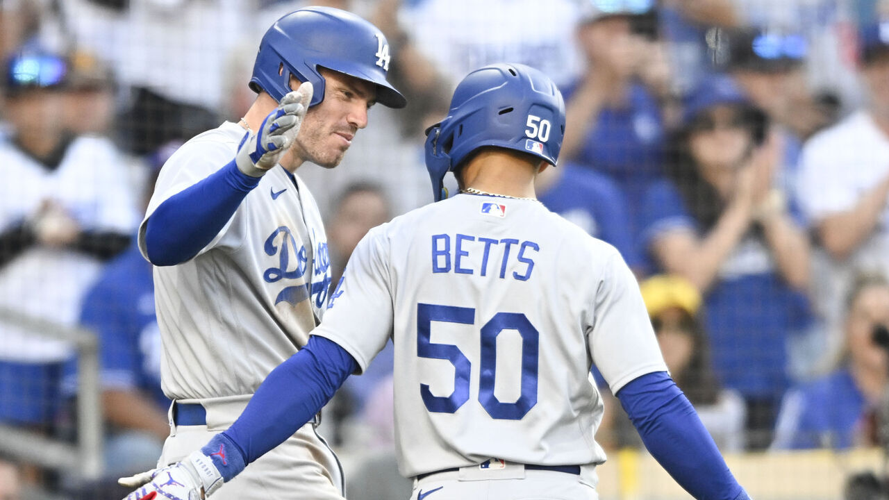 SAN DIEGO, CA - AUGUST 6: Mookie Betts #50 of the Los Angeles Dodgers celebrates his solo home run with Freddie Freeman #5 in the eighth inning against the San Diego Padres on August 6, 2023 at Petco Park in San Diego, California.
