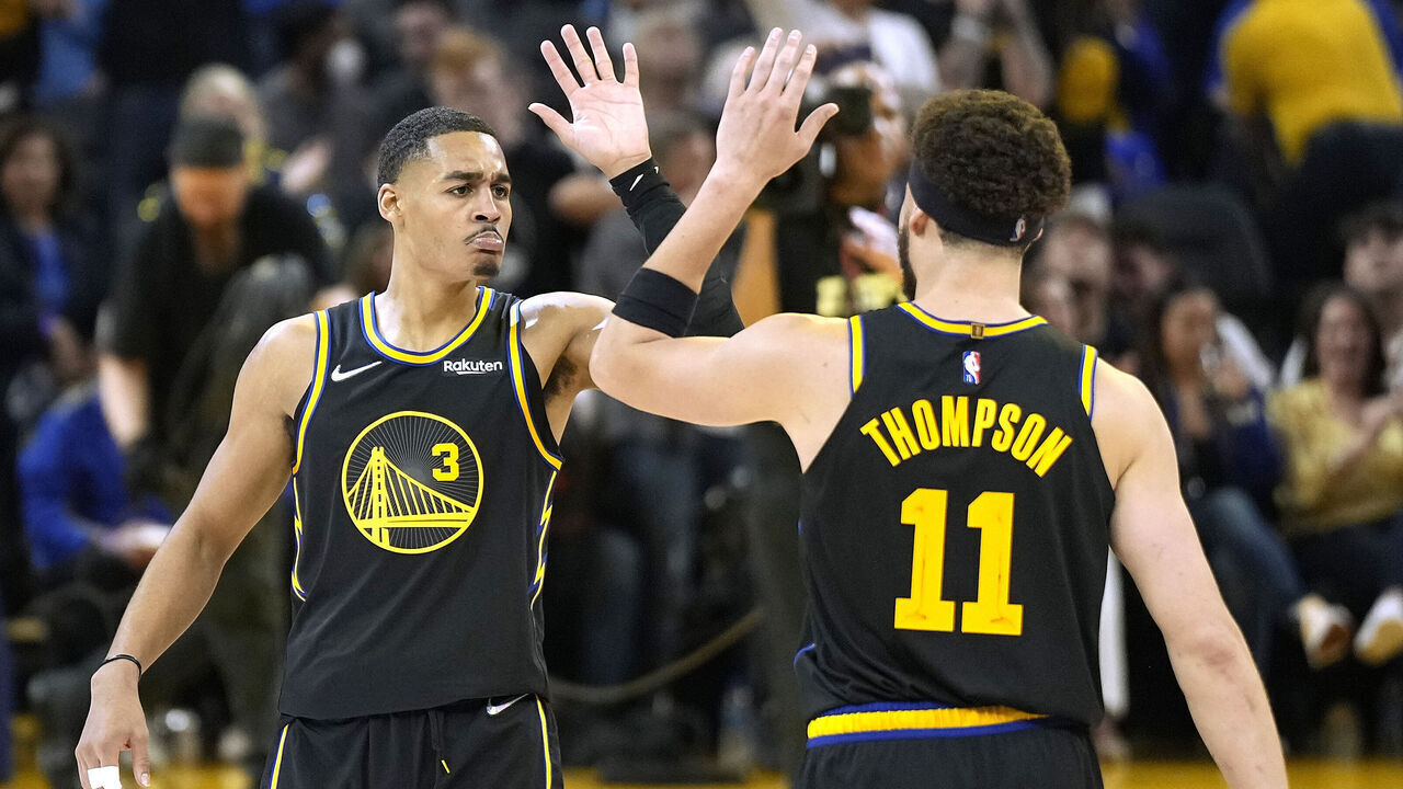SAN FRANCISCO, CALIFORNIA - MAY 07: Jordan Poole #3 and Klay Thompson #11 of the Golden State Warriors high-five after Poole scored and a time out was called by the Memphis Grizzlies during the second half of Game Three of the Western Conference Semifinals of the NBA Playoffs at Chase Center on May 07, 2022 in San Francisco, California.