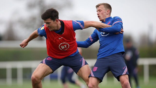 ENFIELD, ENGLAND - MARCH 27: Harry Maguire and James Ward-Prowse of England battle for possession during a training session at Tottenham Hotspur Training Centre on March 27, 2022 in Enfield, England.