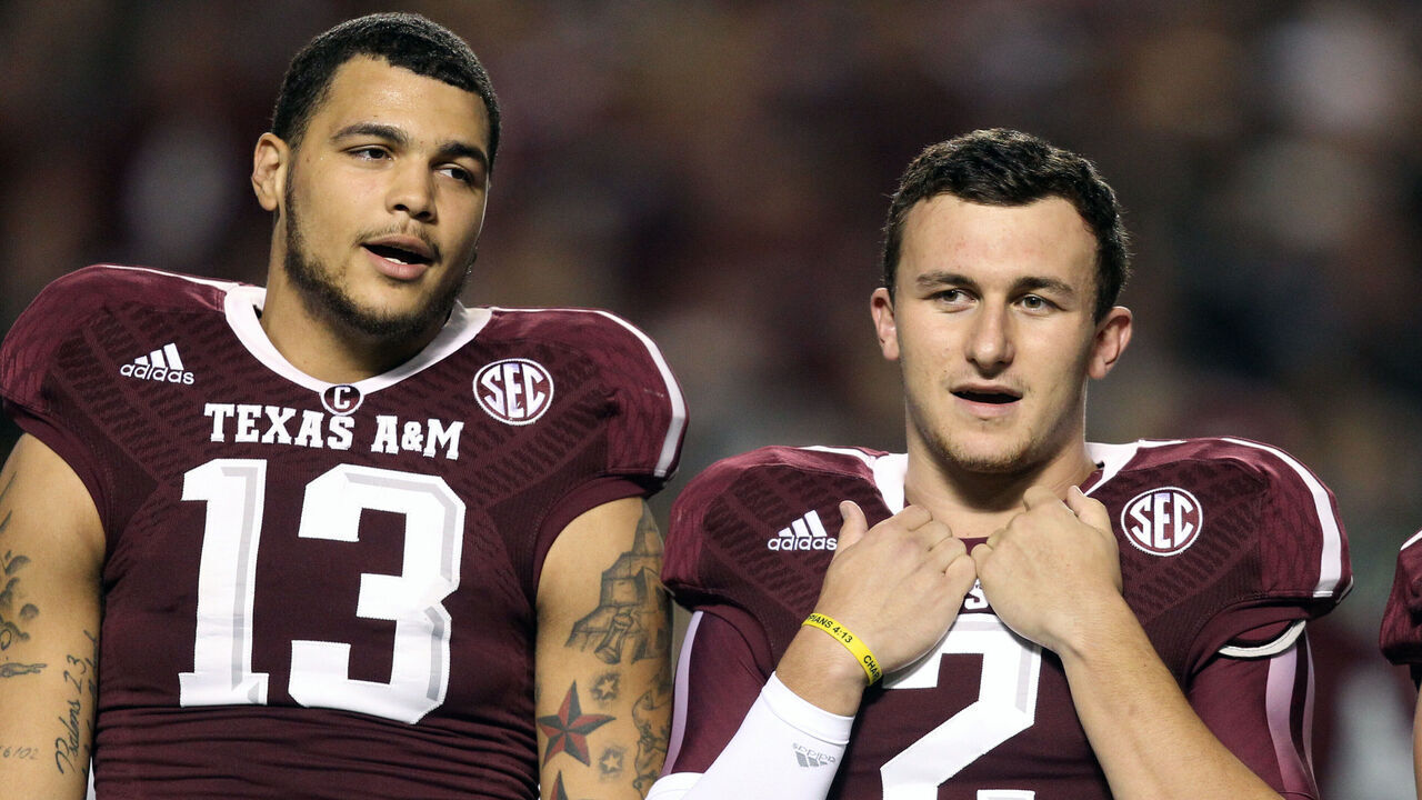 COLLEGE STATION, TX - NOVEMBER 02: Mike Evans #13, Johnny Manziel #2 and Travis Labhart #15 of the Texas A&M Aggies during the playing of "The Spirit of Aggie Land" at Kyle Field on November 2, 2013 in College Station, Texas.