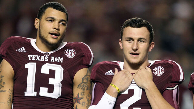 COLLEGE STATION, TX - NOVEMBER 02: Mike Evans #13, Johnny Manziel #2 and Travis Labhart #15 of the Texas A&M Aggies during the playing of "The Spirit of Aggie Land" at Kyle Field on November 2, 2013 in College Station, Texas.