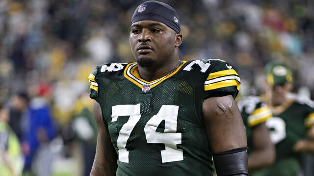 GREEN BAY, WI - SEPTEMBER 20: Elgton Jenkins #74 of the Green Bay Packers walks off the field after a game against the Detroit Lions at Lambeau Field on September 20, 2021 in Green Bay, Wisconsin. The Packers defeated the Lions 35-17.