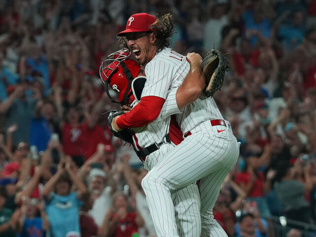 PHILADELPHIA, PENNSYLVANIA - AUGUST 9: Michael Lorenzen (R) #22 of the Philadelphia Phillies celebrates with J.T. Realmuto #10 after throwing a no-hitter against the Washington Nationals at Citizens Bank Park on August 9, 2023 in Philadelphia, Pennsylvania. The Phillies defeated the Nationals 7-0.