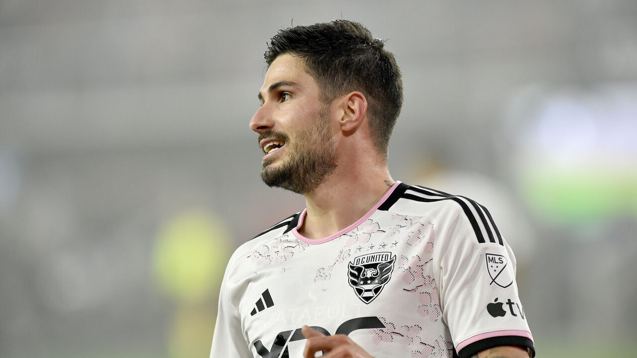 WASHINGTON, DC - MARCH 25: DC United midfielder Taxiarchis Taxi Fountas (11) reacts while wearing the D.C. United Cherry Blossom Kit Jersey during the New England Revolution versus D.C. United Major League Soccer (MLS) game on March 25, 2023 at Audi Field in Washington, D.C..