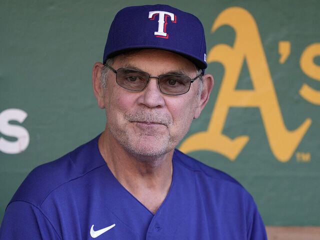 OAKLAND, CALIFORNIA - AUGUST 08: Manager Bruce Bochy #15 of the Texas Rangers looks on from the dugout prior to the start of the game against the Oakland Athletics at RingCentral Coliseum on August 08, 2023 in Oakland, California.