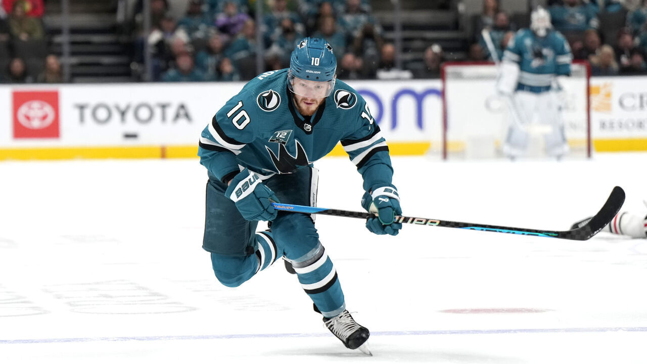 SAN JOSE, CALIFORNIA - FEBRUARY 25: Evgeny Svechnikov #10 of the San Jose Sharks skates with the puck against the Chicago Blackhawks during the second period at SAP Center on February 25, 2023 in San Jose, California.