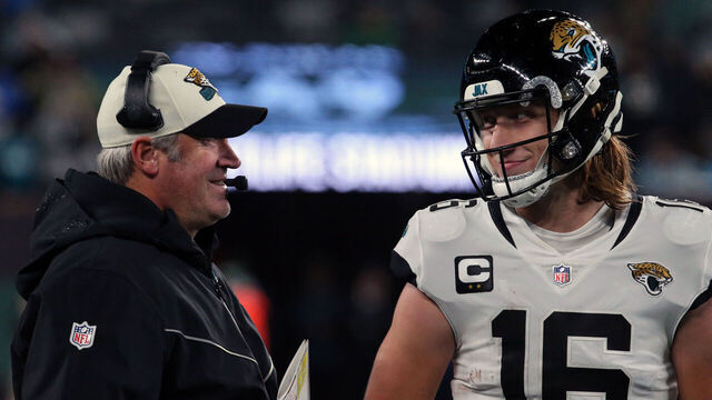 EAST RUTHERFORD, NEW JERSEY - DECEMBER 22: Head Coach Doug Pederson discusses a play with Quarterback Trevor Lawrence #16 of the Jacksonville Jaguars in the Thursday Night Football game in the rain between the Jacksonville Jaguars vs the New York Jets at MetLife Stadium on December 22, 2022 in East Rutherford, New Jersey.