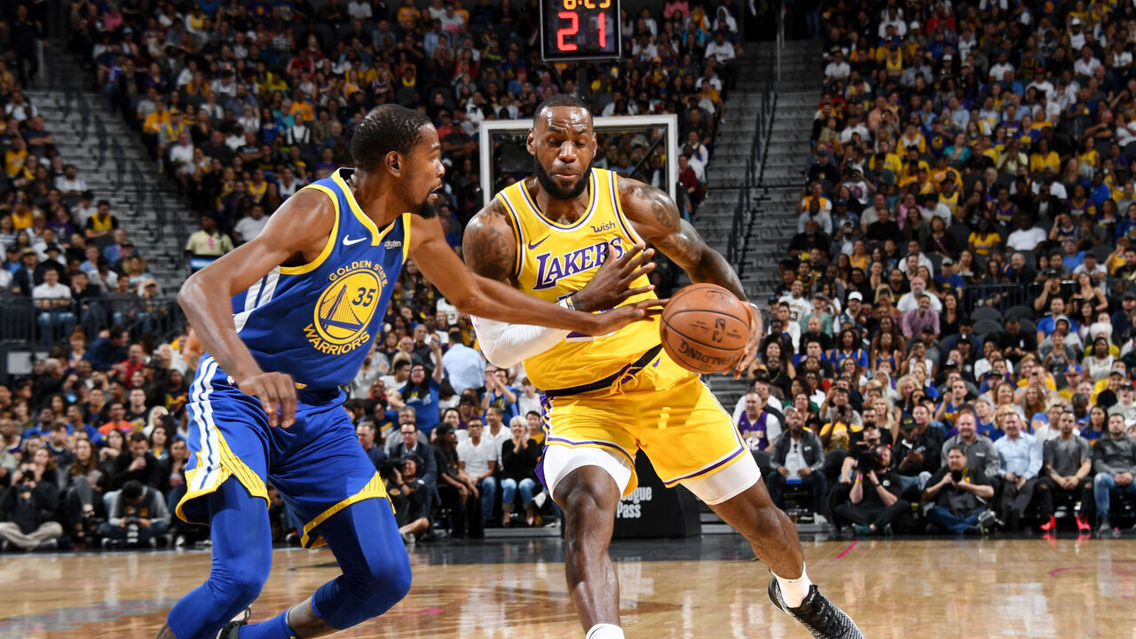 LAS VEGAS, NV- OCTOBER 10: Kevin Durant #35 of the Golden State Warriors defends against LeBron James #23 of the Los Angeles Lakers during a pre-season game on October 10, 2018 at T-Mobile Arena in Las Vegas, Nevada. NOTE TO USER: User expressly acknowledges and agrees that, by downloading and/or using this Photograph, user is consenting to the terms and conditions of the Getty Images License Agreement. Mandatory Copyright Notice: Copyright 2018 NBAE
