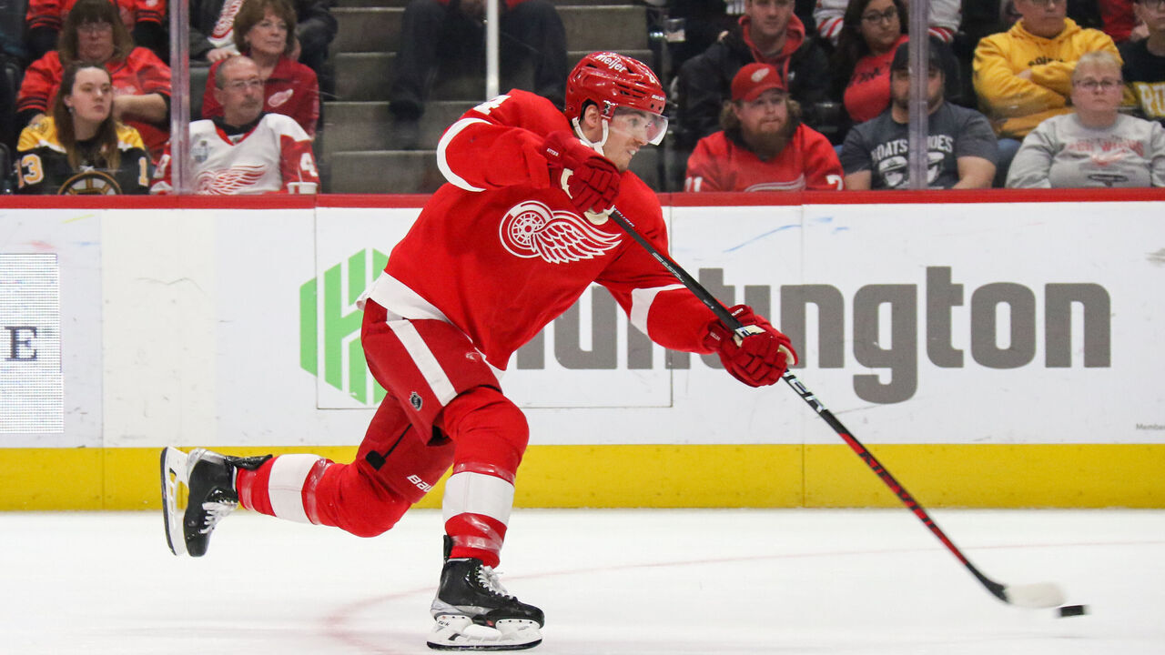 DETROIT, MI - MARCH 12: Detroit Red Wings forward Pius Suter (24) shoots the puck during the second period of an NHL regular season hockey game between the Boston Bruins and the Detroit Red Wings on March 12, 2023 at Little Caesars Arena in Detroit, Michigan.