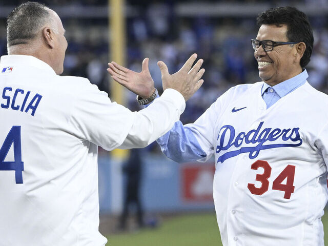Los Angeles, - March 30: Mike Scioscia, left, greets Fernando Valenzuela prior to throwing out the ceremonial pitch prior to a Opening Day baseball game between the Los Angeles Dodgers and the Arizona Diamondbacks at Dodger Stadium in Los Angeles on Thursday, March 30, 2023.