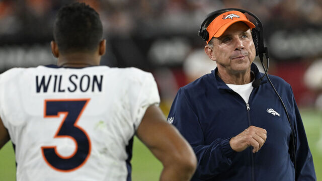 GLENDALE, ARIZONA - AUGUST 11: Denver Broncos quarterback Russell Wilson (3) and Head Coach Sean Payton walks passed each other on the sideline during a preseason game at State Farm Stadium on August 11, 2023 in Glendale, Arizona. The Arizona Cardinals hosted the Denver Broncos for their first NFL preseason game of the 2023 season.