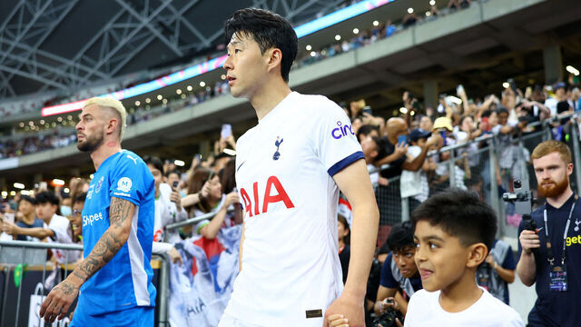 SINGAPORE, SINGAPORE - JULY 26: Maxime Lestienne #17 of the Lion City Sailors and Son Heung-Min #7 of Tottenham Hotspur walk out of the tunnel with ball kids prior to the pre-season friendly at the National Stadium on July 26, 2023 in Singapore.