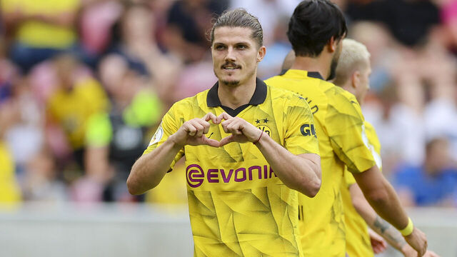 MAINZ, GERMANY - AUGUST 12: Marcel Sabitzer of Borussia Dortmund celebrates after scoring his teams fourth goal during the DFB cup first round match between TSV Schott Mainz and Borussia Dortmund at MEWA Arena on August 12, 2023 in Mainz, Germany.