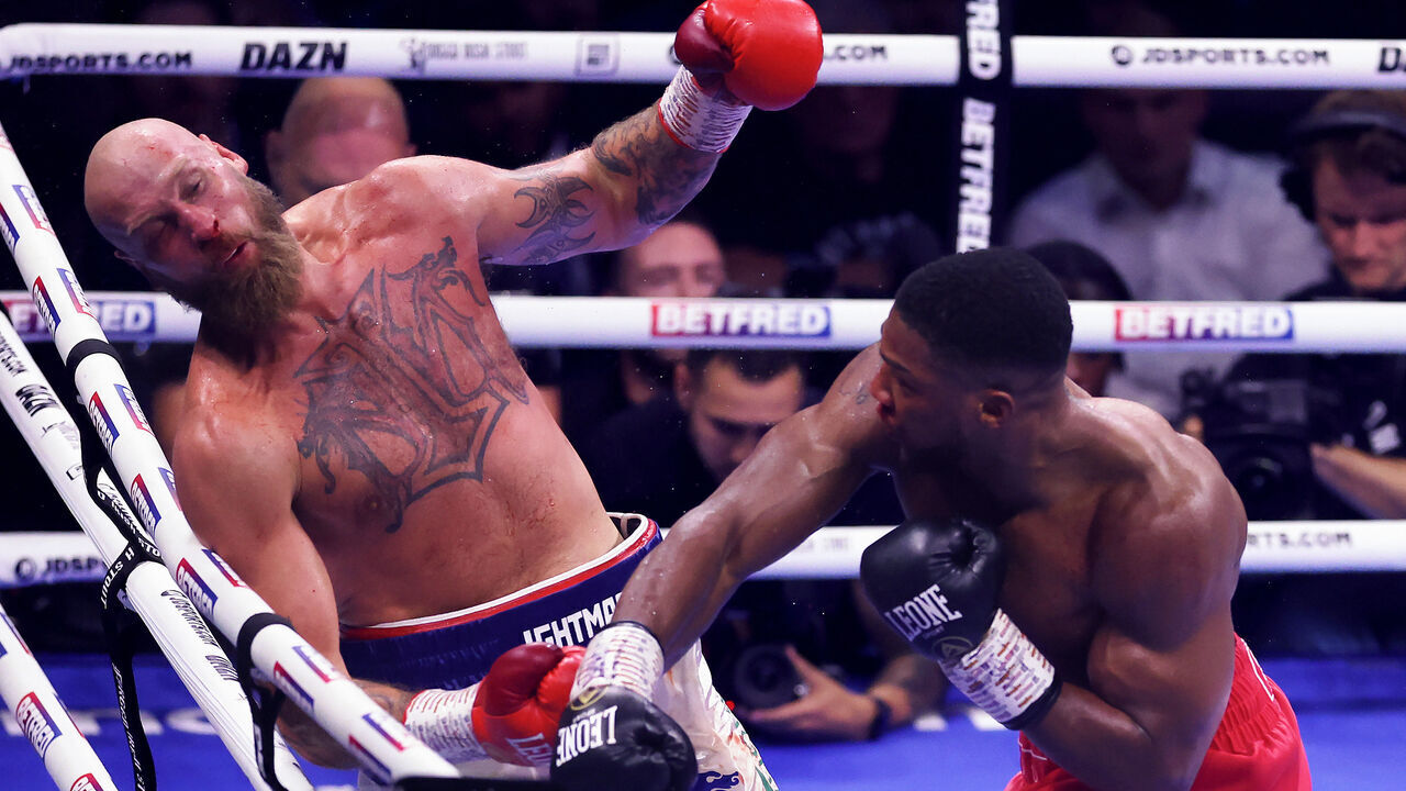 LONDON, ENGLAND - AUGUST 12: Anthony Joshua knocks down Robert Helenius during the Heavyweight fight between Anthony Joshua and Robert Helenius at The O2 Arena on August 12, 2023 in London, England.