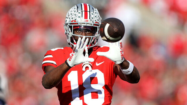 COLUMBUS, OH - NOVEMBER 26: Ohio State Buckeyes wide receiver Marvin Harrison Jr. (18) catches the football on the sideline during the second quarter of the college football game between the Michigan Wolverines and Ohio State Buckeyes on November 26, 2022, at Ohio Stadium in Columbus, OH.