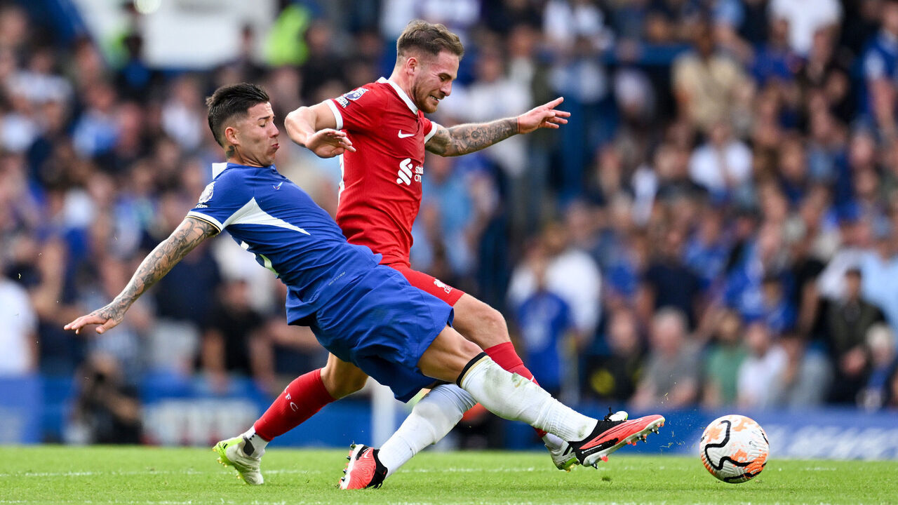 LONDON, ENGLAND - AUGUST 13: Alexis Mac Allister of Liverpool is challenged by Enzo Fernandez of Chelsea during the Premier League match between Chelsea FC and Liverpool FC at Stamford Bridge on August 13, 2023 in London, England.