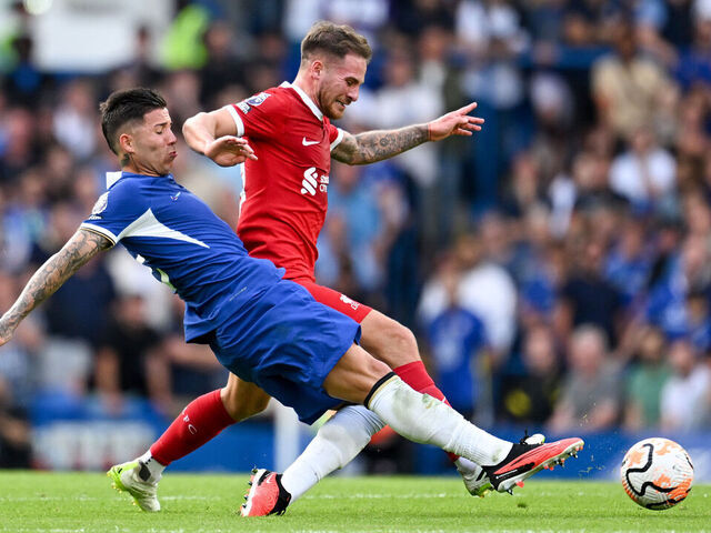 LONDON, ENGLAND - AUGUST 13: Alexis Mac Allister of Liverpool is challenged by Enzo Fernandez of Chelsea during the Premier League match between Chelsea FC and Liverpool FC at Stamford Bridge on August 13, 2023 in London, England.