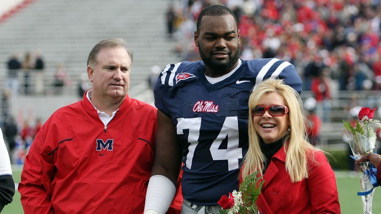 OXFORD, MS - NOVEMBER 28: Michael Oher #74 of the Ole Miss Rebels stands with his family during senior ceremonies prior to a game against the Mississippi State Bulldogs at Vaught-Hemingway Stadium on November 28, 2008 in Oxford, Mississippi.